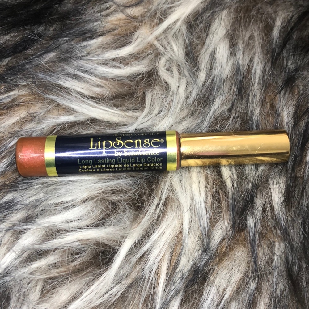 Lipsense lipstick in the color Plum Pretty.